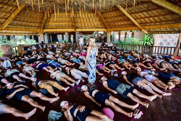 Catherine guiding a large group breathwork session
